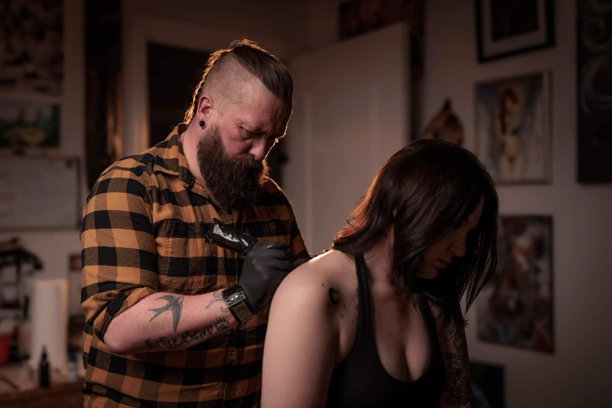 Jason Johnston working on a tattoo in his studio